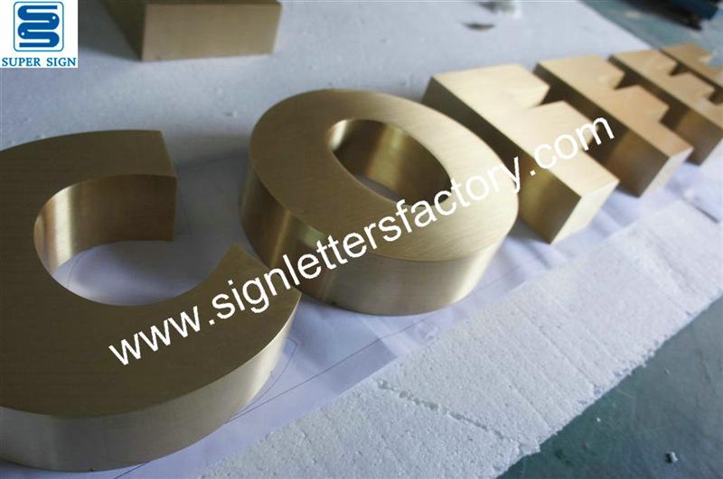 brushed brass letter signage
